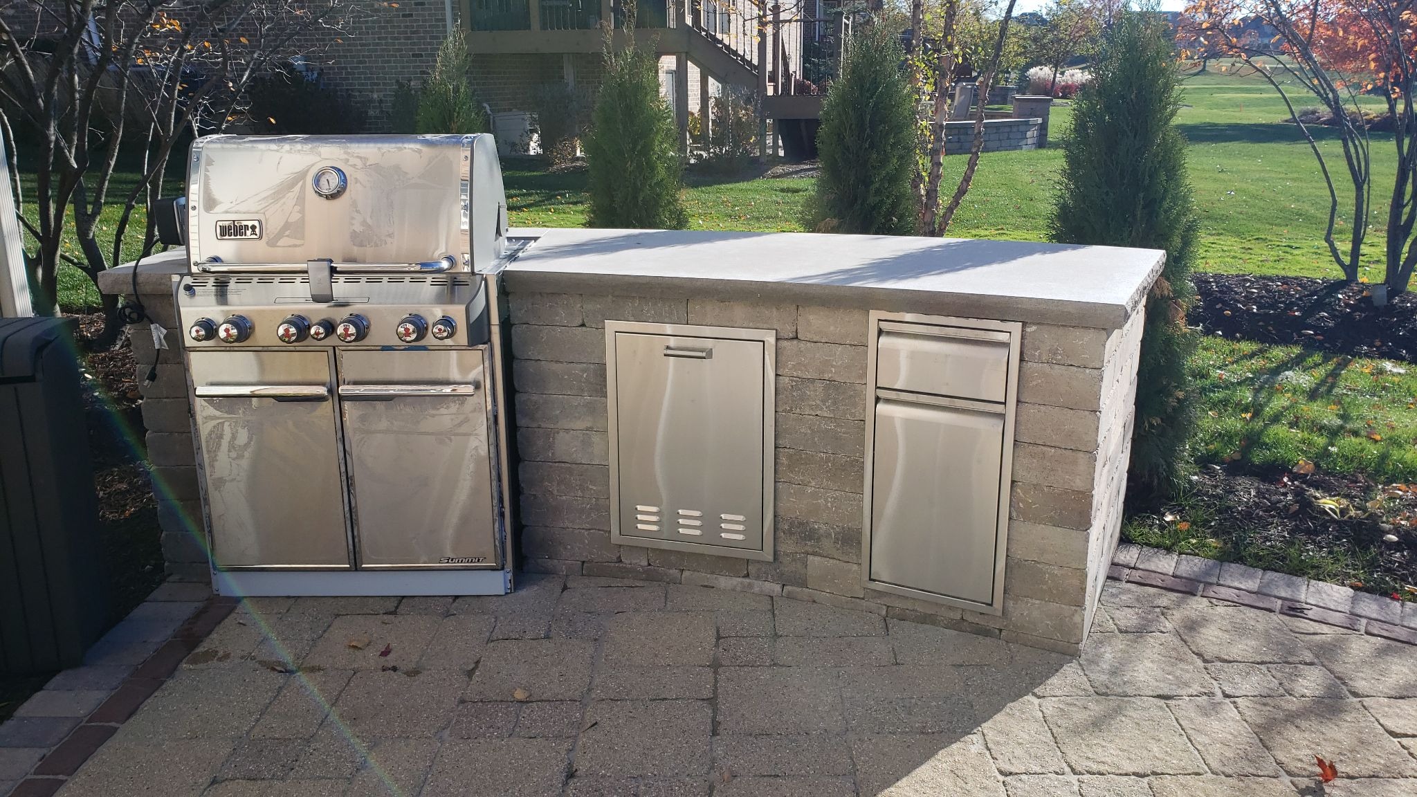 Custom outdoor kitchen on a paver patio installed by Archadeck of Chicagoland
